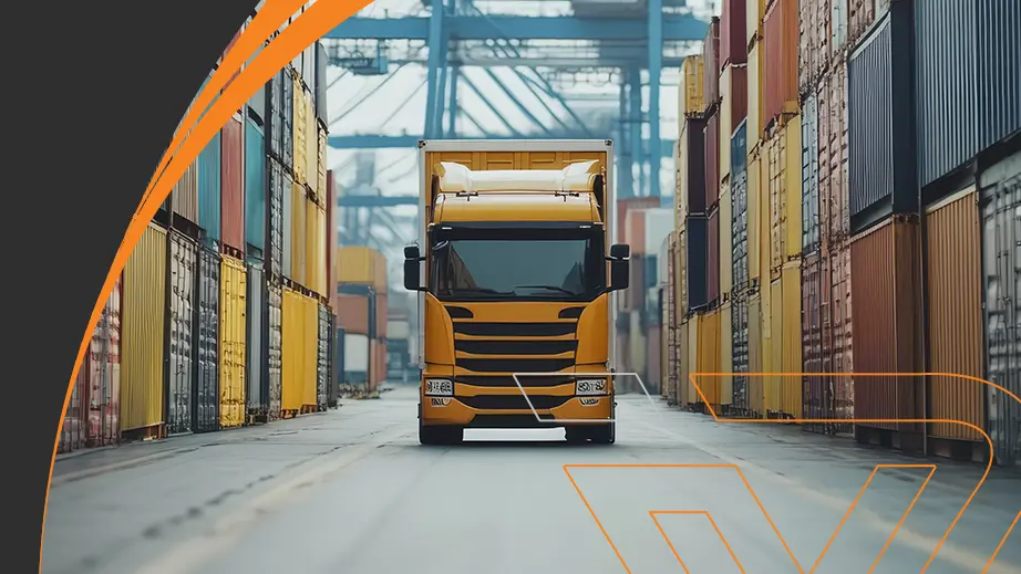 Cargo truck in port with containers, illustrating the logistics of importing automotive parts by Voraus Auto Classics.